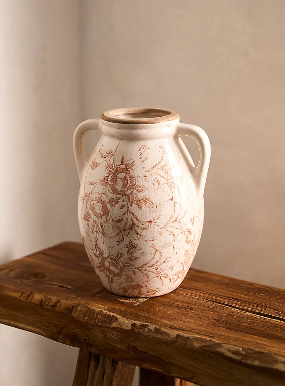 Ancient flowers handled vase