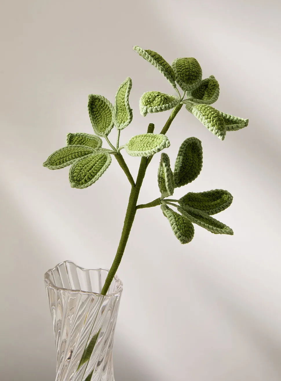 Artificial green leaves crocheted branch