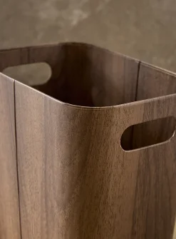 Dark faux-wood wastebasket