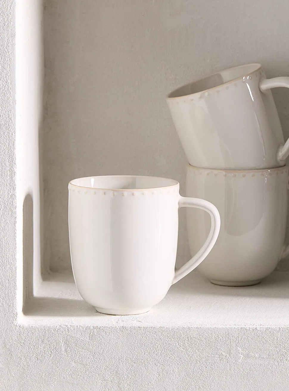 Embossed polka dots white mug