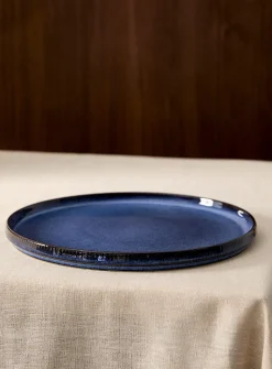 Large grooved blue plate