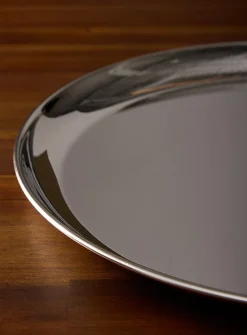 Large round metallic serving tray