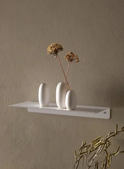 Minimalist steel wall shelf