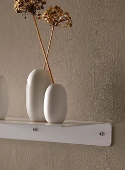 Minimalist steel wall shelf