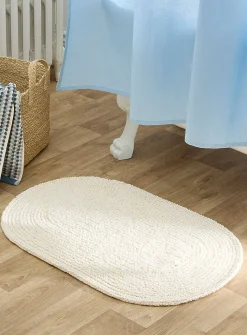 Oval reversible bath mat