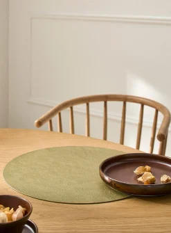 Round faux-leather placemat