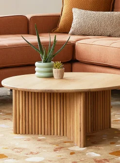 Round natural grooved coffee table