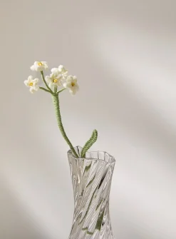 Small white flowers imitation crocheted branch