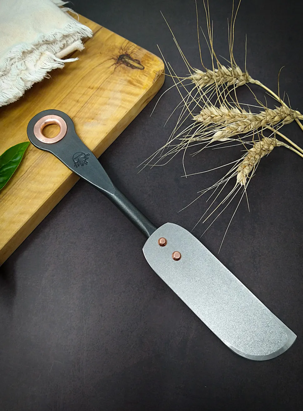 Stainless steel and copper cheese knife