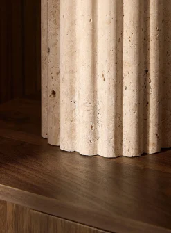 Table lamp with fluted travertine base